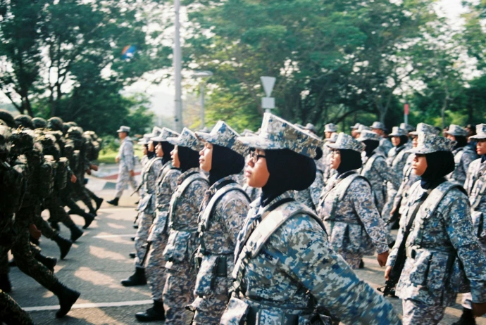 soldiers in black and white uniform standing on gray concrete road during daytime
